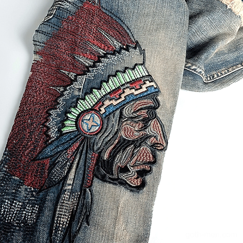 Close-up macro shot of Native American chief head embroidery on denim, detailed stitching and symbolic gothic imagery