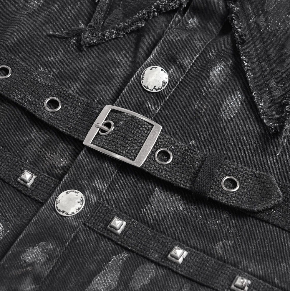 Detailed flat lay of gothic denim shirt hardware including square metal buckle, snap buttons, and square studs