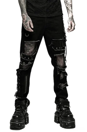 Distressed mesh splice gothic denim trousers front three-quarter view with side lacing and ankle zipper details