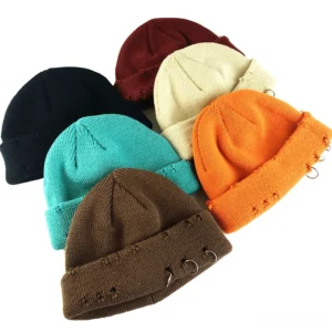 Collection of gothic distressed beanies with metal rings in multiple dark colorways including black, navy, gray, and wine red