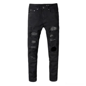 Men's black gothic slim fit ripped jeans with rhinestone embellishments front view flat lay