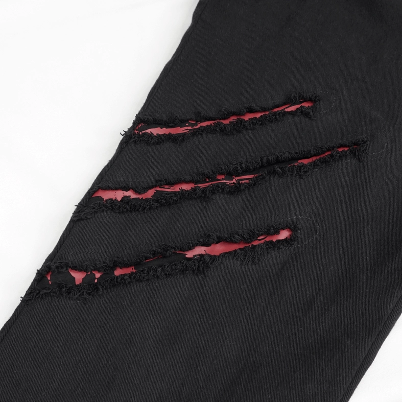 Gothic black distressed ripped trousers complete styling shot showing fitted silhouette and multiple tear placements