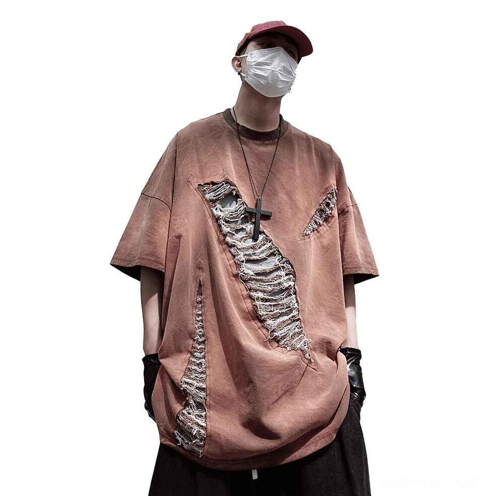 Oversized ripped gothic T-shirt in oxblood reddish brown with diagonal frayed patches, front three-quarter view
