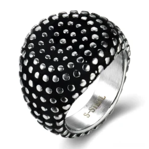 Vintage dotted stainless steel gothic ring with aged silver-black finish showing raised dot texture relief from top and side angle