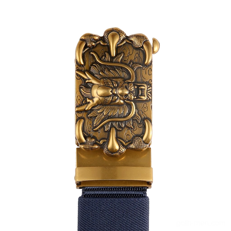 Close-up shot of antique bronze dragon buckle with carved relief design on navy nylon strap