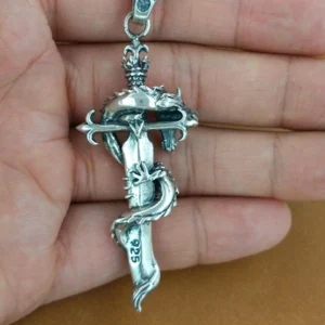 Dragon sword necklace pendant in hand overhead view displaying 925 hallmark on blade and crown-style bail detail