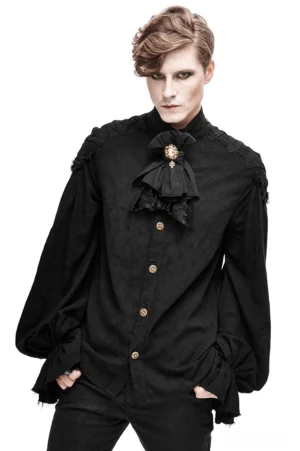 Male model wearing black Victorian gothic dress shirt with stand collar, lace bow accent, and voluminous flared ruffled cuffs - front full body view