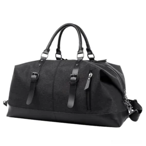 Black Oxford canvas gothic duffel bag with black leather trim and side zipper pocket, front view with minimalist dark aesthetic