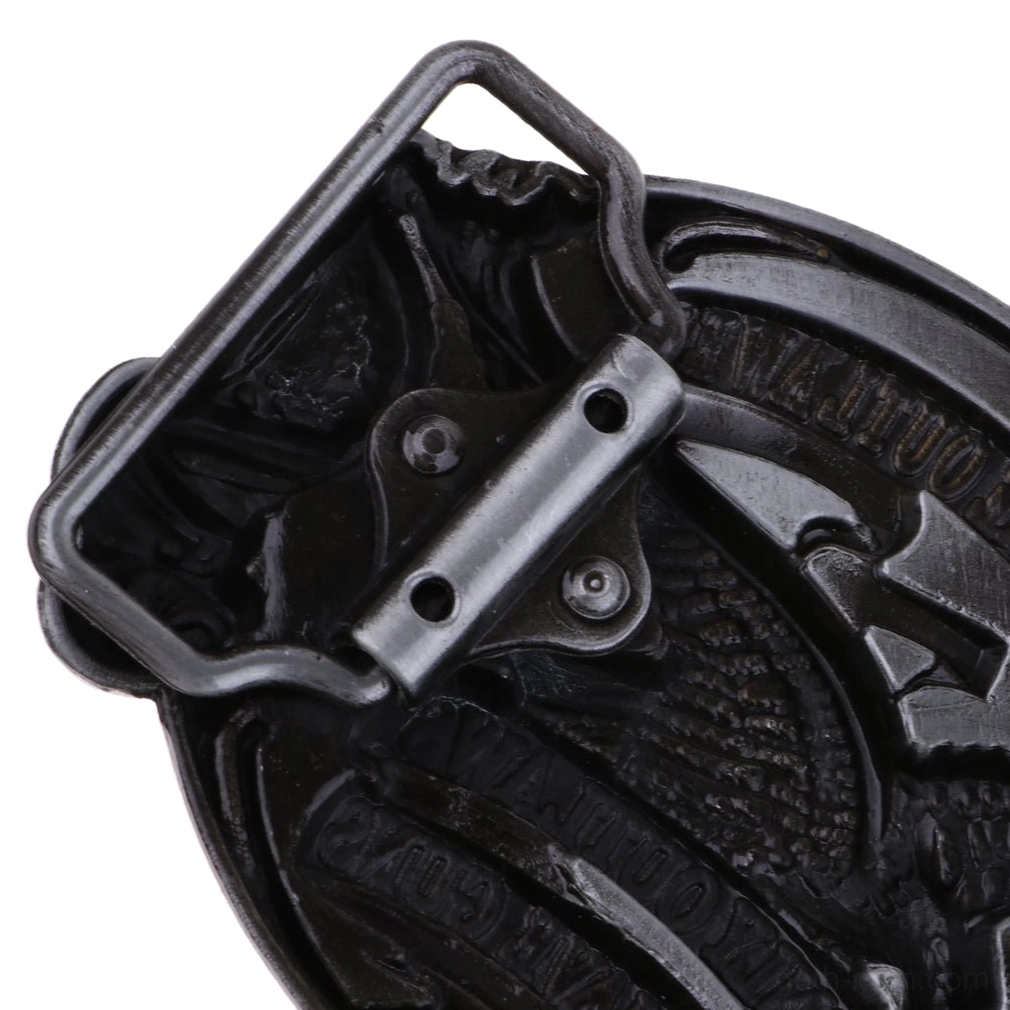 Close-up overhead view of gothic eagle belt buckle reverse showing dark silver material and detailed fastener components