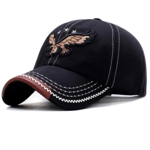 Black 3D eagle embroidered gothic baseball cap with contrast stitching and faux leather brim detail, three-quarter front view