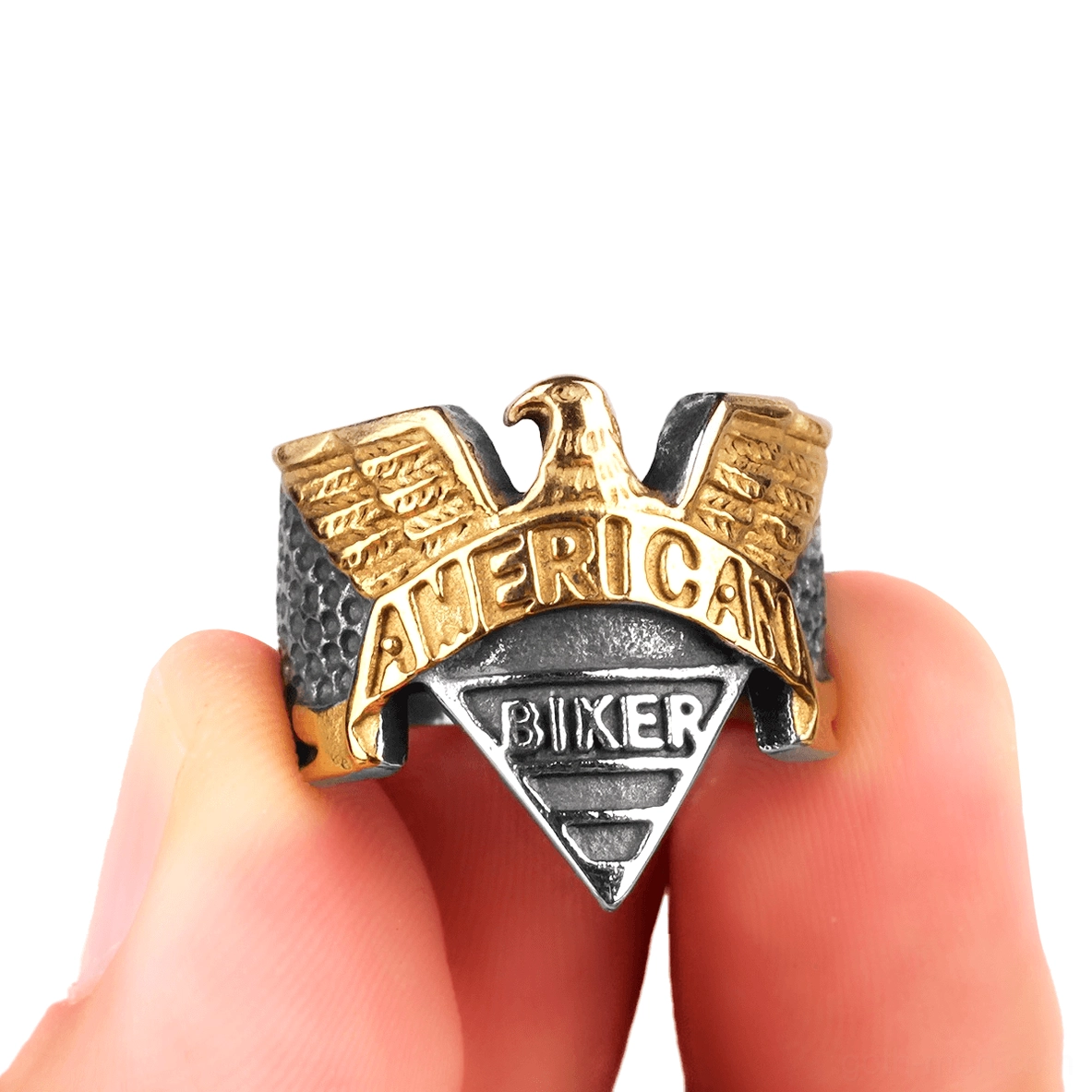 Two-tone eagle signet ring held in hand showing gothic design detail and scale