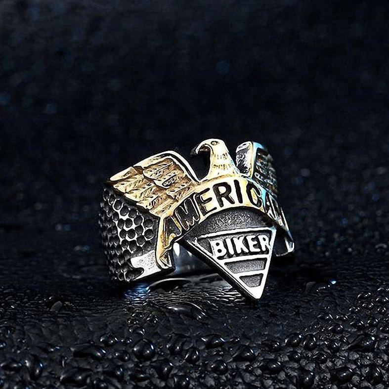 Side view of two-tone gothic eagle ring displaying band profile and textured detailing