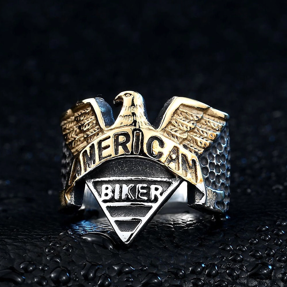 Dark atmospheric view of two-tone gothic eagle ring with water droplet background aesthetic
