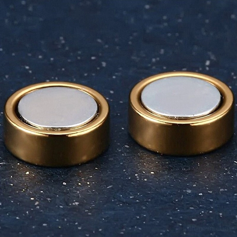 Alternative fashion magnetic stud earrings paired with gothic style accessories