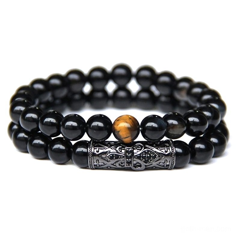 Alternative gothic bracelet with tiger's eye stones and matte black beads paired with carved metal band embellishment
