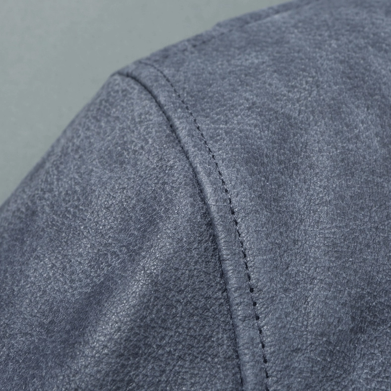 Gothic embroidered leather jacket close-up showing embroidery quality and patch attachment craftsmanship
