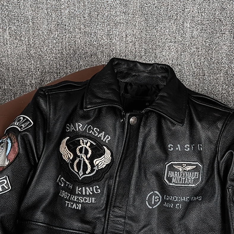 Gothic embroidered leather motorcycle jacket front view showing full tactical patch placement and design composition
