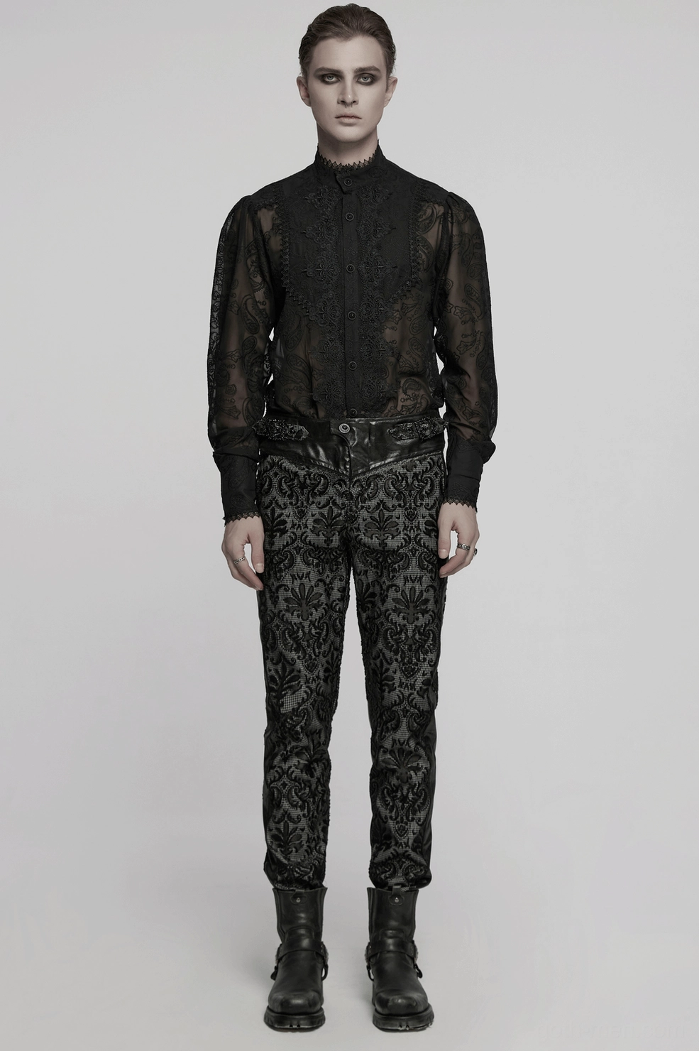 Full body styling shot of gothic embroidered lace slim-fit pants worn with alternative fashion aesthetic