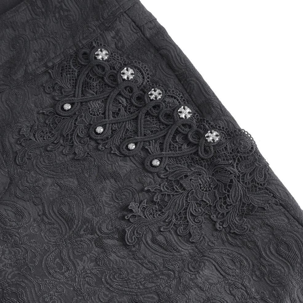 Gothic black embroidered trousers detail showing metal stud placement and jacquard weave