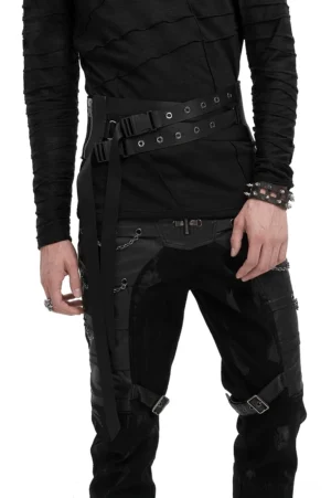 Male model wearing black gothic decussate eyelet buckle corset belt in front three-quarter view, paired with all-black alternative outfit
