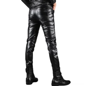 Men's black faux leather pants rear three-quarter view showing back pocket design and slim fit silhouette