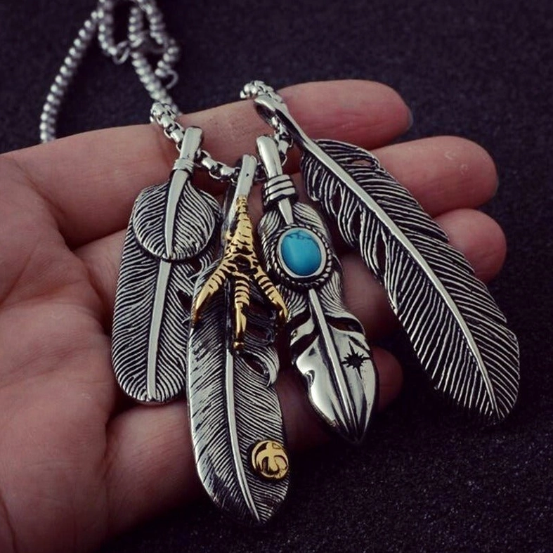 Gothic feather claw pendant necklace in natural lighting, demonstrating zinc alloy durability and figaro chain craftsmanship