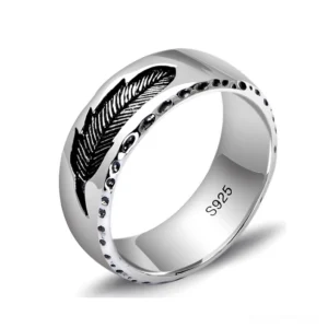 Unisex gothic feather sterling silver ring with S925 hallmark - 3/4 oblique view showing intricate black feather engraving and dotted border detail on polished silver band