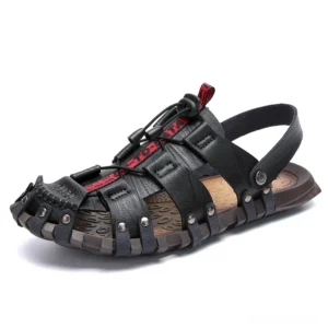 Black leather gothic fisherman sandals with toggle drawstring closure and rivet decorated sole, left front three-quarter view studio shot