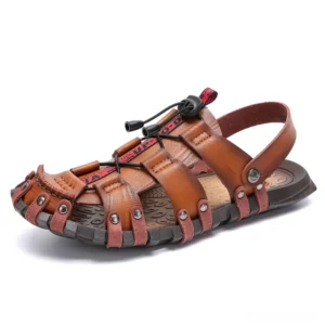 Tan brown leather gothic beach sandals with hollow breathable design and sturdy rubber outsole, left side profile view