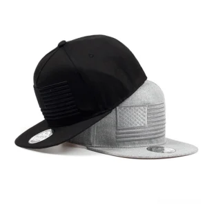 Black and heather gray gothic snapback caps stacked side by side