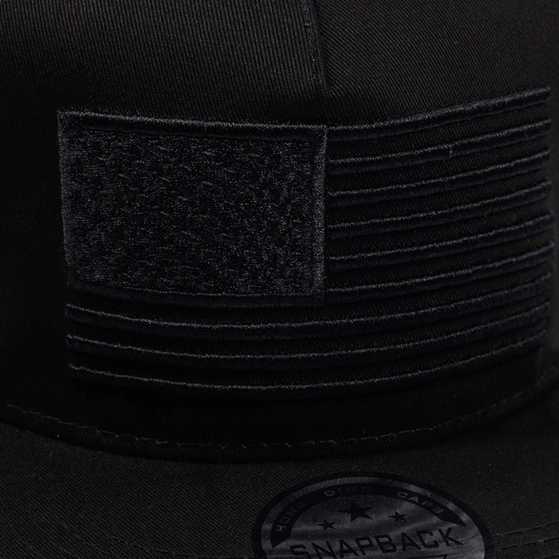 Close-up macro of black embroidered USA flag tonal stitching detail