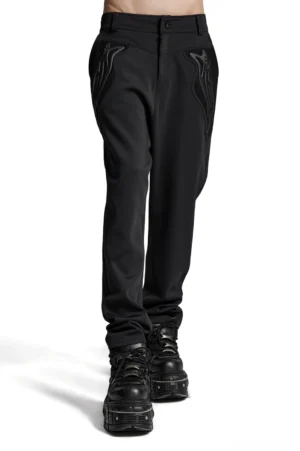 Gothic cyberpunk knitted pants with 3D flame appliqués and metallic rivets - front side view worn by model