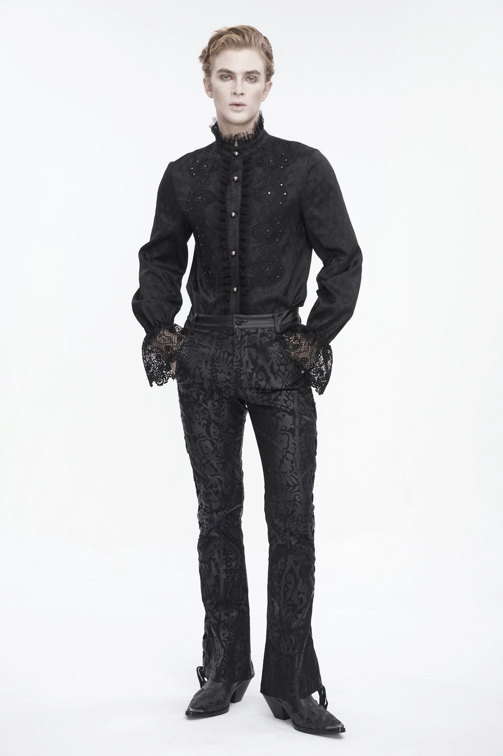 Detail shot of fabric quality and damask print texture on gothic flared trousers