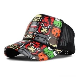 Goth graffiti trucker cap with colorful monster prints and black mesh side panels, left front three-quarter view