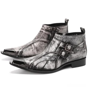 Gothic grey leather ankle boots with dual buckle straps and metal pointed toe, three-quarter front view