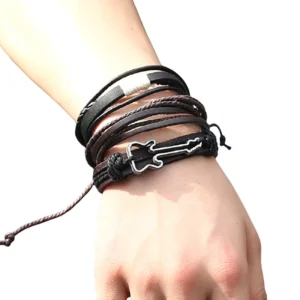 Punk rock leather bracelet with guitar charm worn on male model wrist, showing side profile with adjustable pull-tie closure and antique silver plated metal guitar charm detail against white background