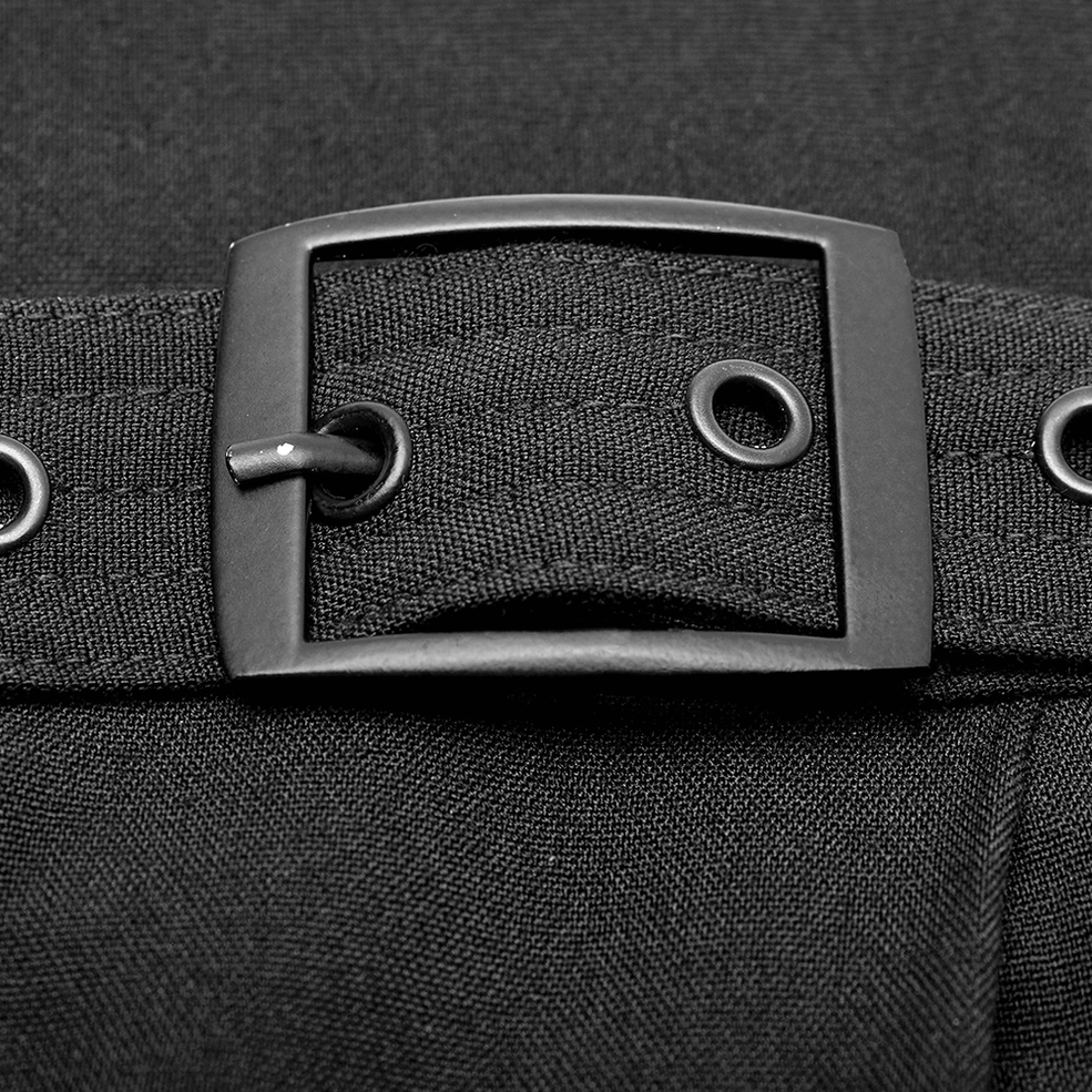 Close-up macro detail of black gothic hakama pants metal square buckle fastener, fabric eyelet, and woven textile texture