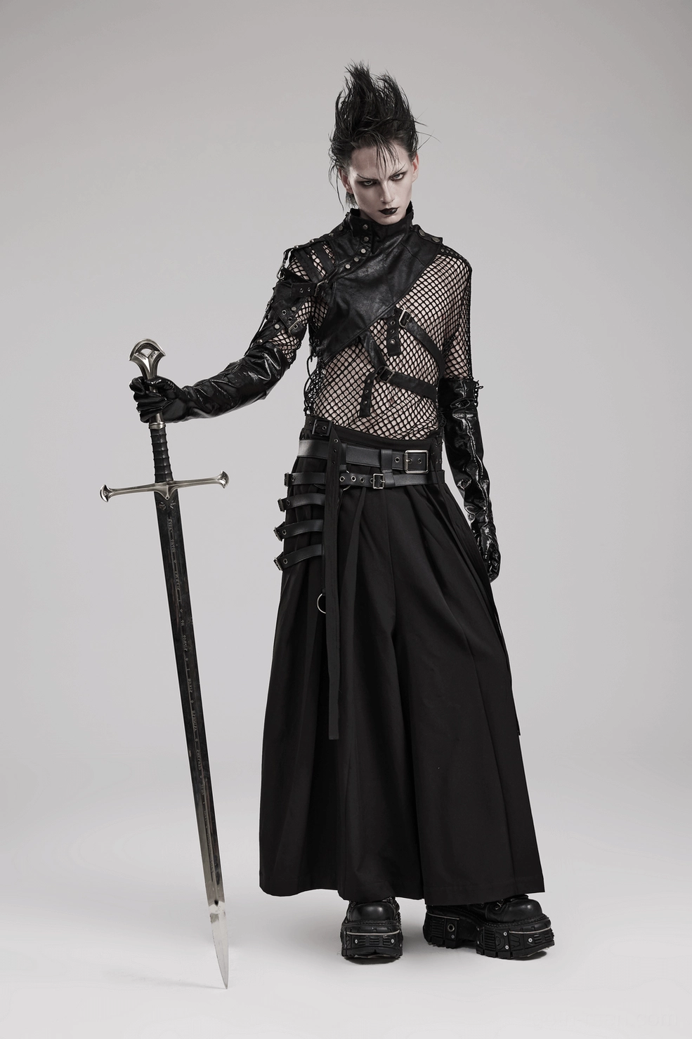 Black gothic hakama pants pleated leg structure and flowing fabric movement demonstrating design silhouette