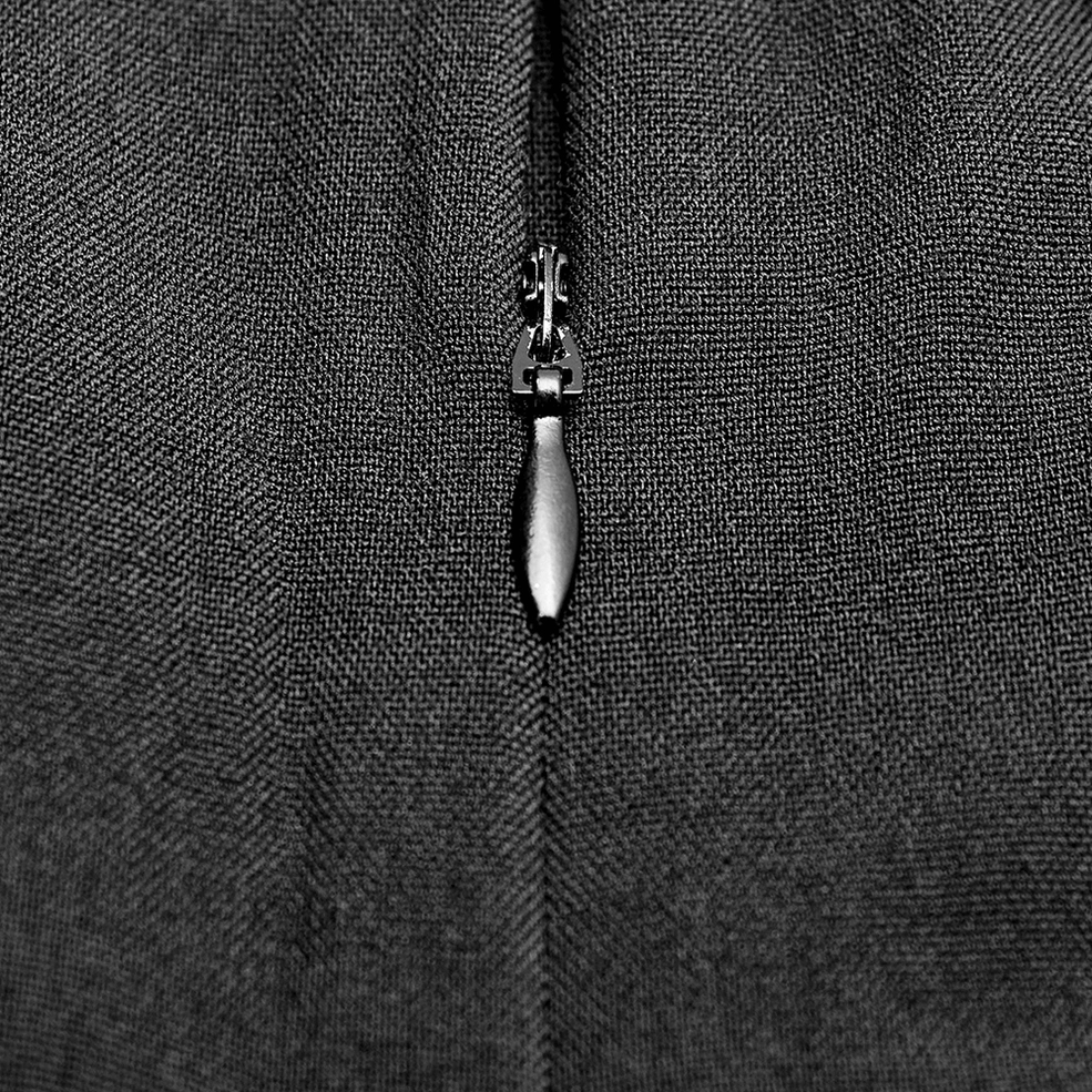 Black gothic hakama pants construction detail showing fabric weight, seam quality, and material composition close-up