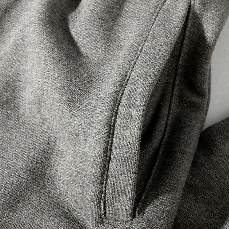 Drawstring adjustment detail on gothic harem joggers waistband, showing elastic and cord mechanism