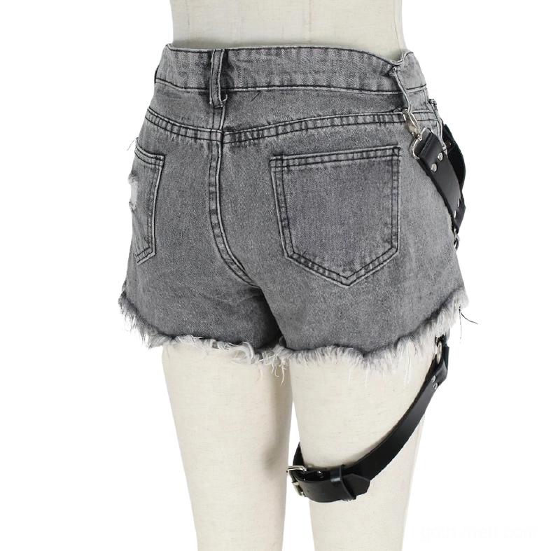 Industrial goth leg harness back view showing metal buckle and thigh strap attachment on denim