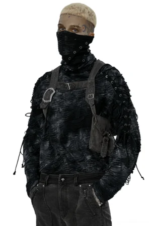 Front three-quarter view of distressed gothic harness crossbody bag worn by male model, featuring antique silver metal buckles and industrial design