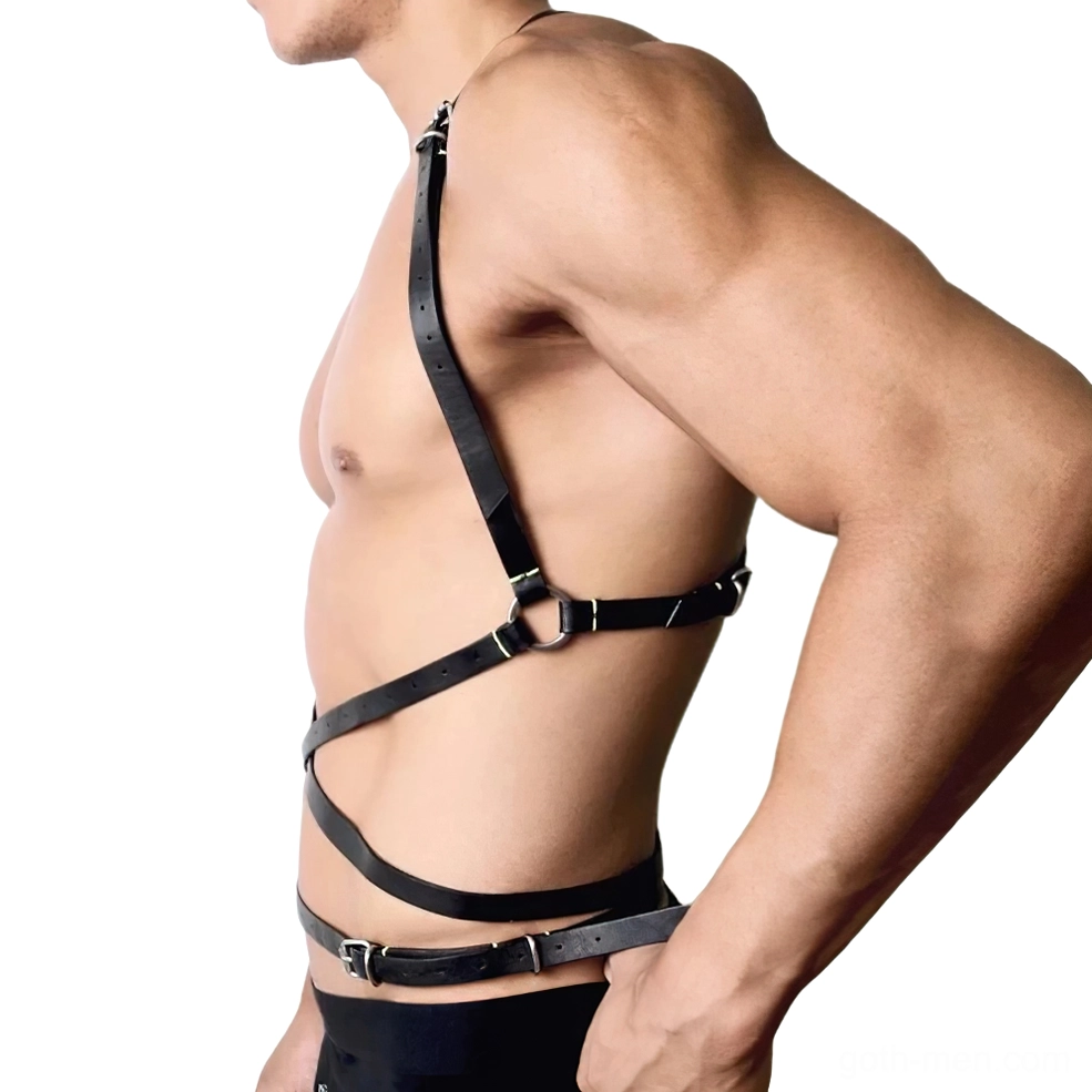 Left side profile of black faux leather harness with cross side straps and metal hardware on male model