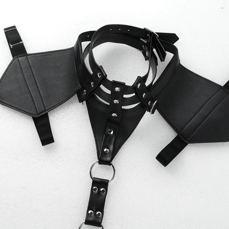Close-up of adjustable harness straps with metal pin buckles and leather construction