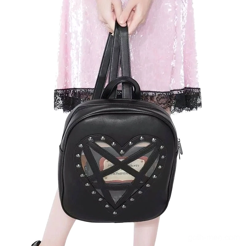 Handheld gothic heart backpack front display showing transparent window design, studded trim, top carry handle, smooth leather finish, studio shot