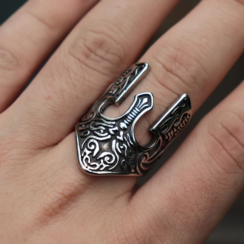 Stainless steel gothic warrior helmet ring worn on index finger, close-up hand view