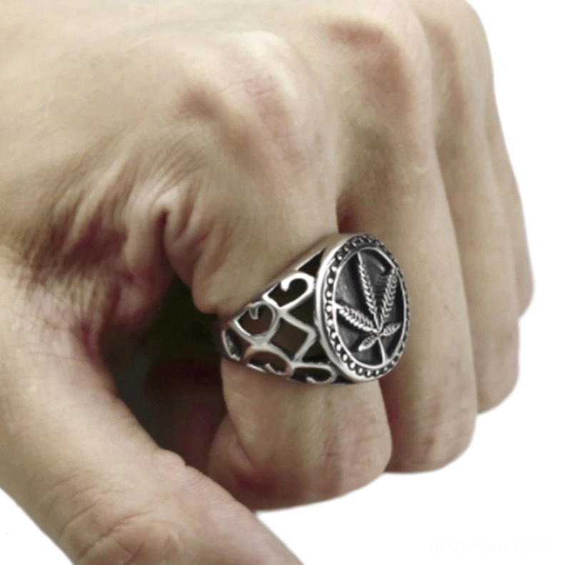 Silver hemp leaf signet ring side view on finger displaying full design details and proportions