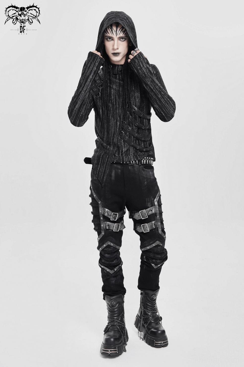 Three-quarter rear view of gothic hooded top on model, showing fitted back and strap details