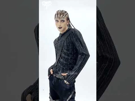 Side profile of industrial gothic hooded top on male model, showcasing fitted architecture and side strap details