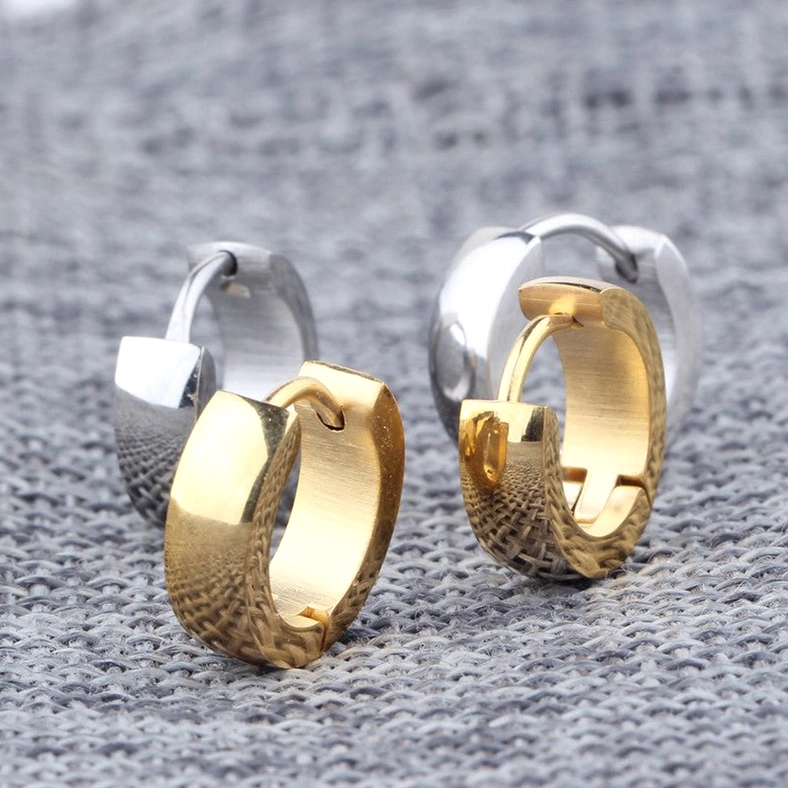 Mixed finish gothic huggie hoop earrings collection showing silver polished, gold polished, and textured gold options